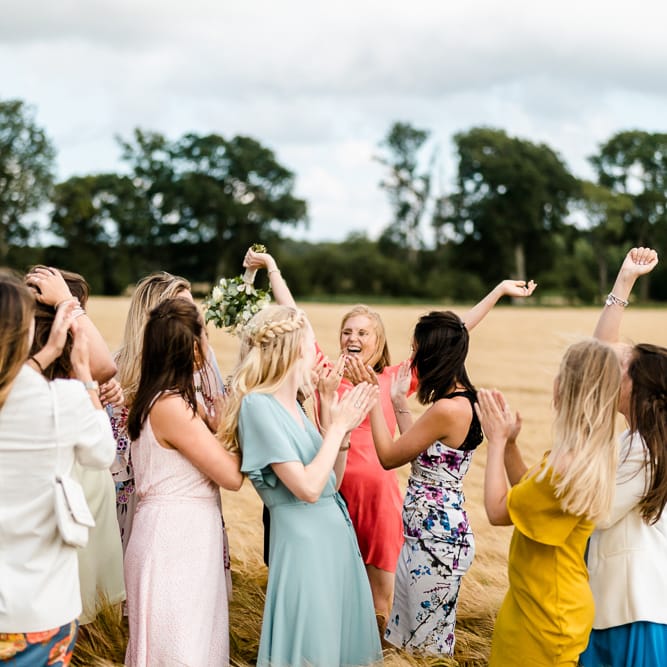 Bouquet Toss | Traditional Green/Blue Danish Wedding at Scandinavian Country House, Jomfruens Egede in Faxe, Denmark | John Barwood Photography