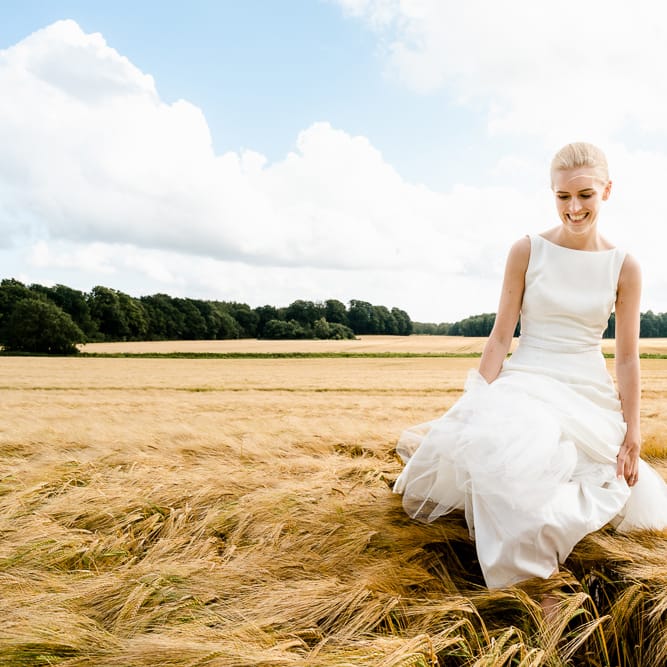Bride in Caroline Castigliano Wedding Dress | Traditional Green/Blue Danish Wedding at Scandinavian Country House, Jomfruens Egede in Faxe, Denmark | John Barwood Photography
