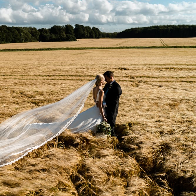 Bride in Caroline Castigliano Wedding Dress | Groom in Henry Herbert Tailors Morning Suit | Traditional Green/Blue Danish Wedding at Scandinavian Country House, Jomfruens Egede in Faxe, Denmark | John Barwood Photography