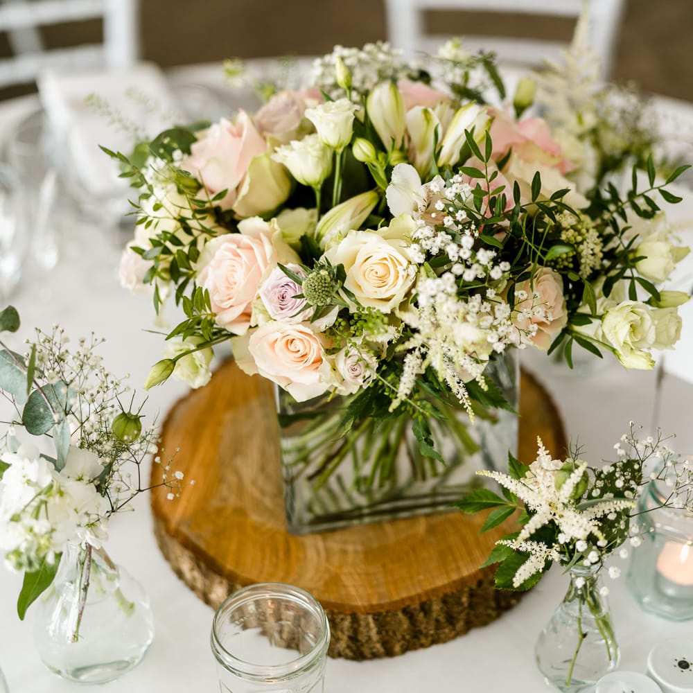 Pink, White &amp; Green Floral Centrepiece on Tree Slab | Traditional Green/Blue Danish Wedding at Scandinavian Country House, Jomfruens Egede in Faxe, Denmark | John Barwood Photography