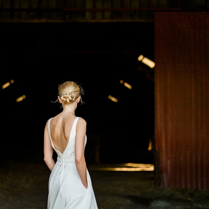 Bride in Caroline Castigliano Wedding Dress with Buttons on the Back | Traditional Green/Blue Danish Wedding at Scandinavian Country House, Jomfruens Egede in Faxe, Denmark | John Barwood Photography