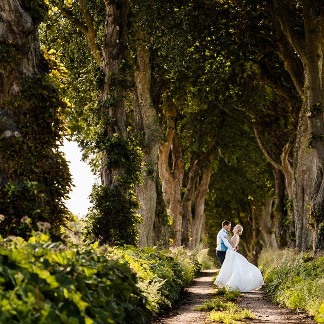 Bride in Caroline Castigliano Wedding Dress | Groom in Henry Herbert Tailors Morning Suit | Traditional Green/Blue Danish Wedding at Scandinavian Country House, Jomfruens Egede in Faxe, Denmark | John Barwood Photography