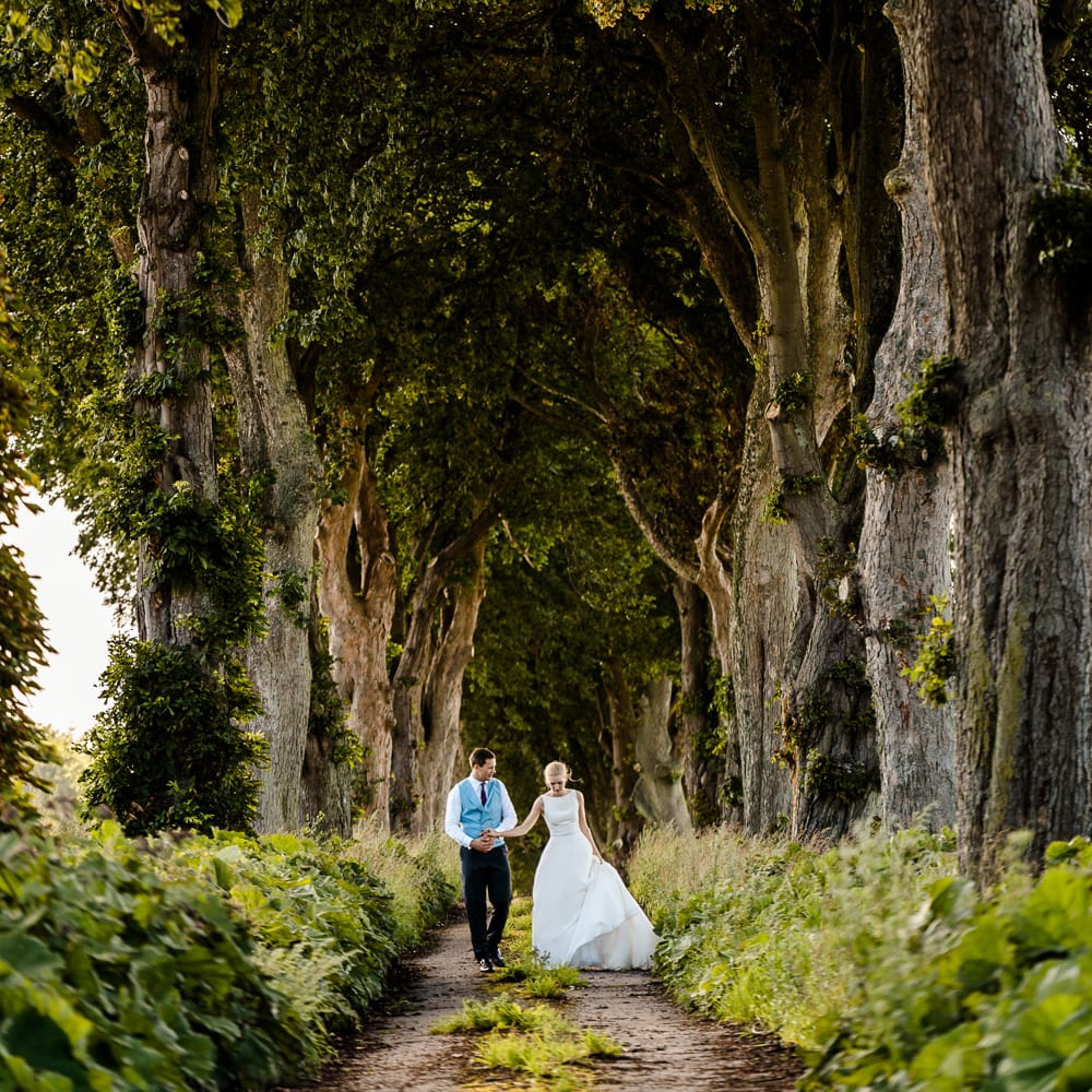 Bride in Caroline Castigliano Wedding Dress | Groom in Henry Herbert Tailors Morning Suit | Traditional Green/Blue Danish Wedding at Scandinavian Country House, Jomfruens Egede in Faxe, Denmark | John Barwood Photography