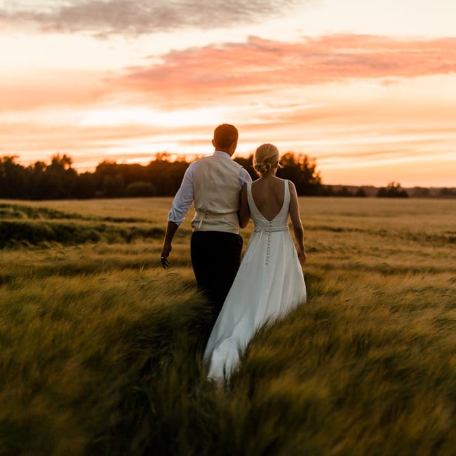 Sunset Portrait | Bride in Caroline Castigliano Wedding Dress | Groom in Henry Herbert Tailors Morning Suit | Traditional Green/Blue Danish Wedding at Scandinavian Country House, Jomfruens Egede in Faxe, Denmark | John Barwood Photography