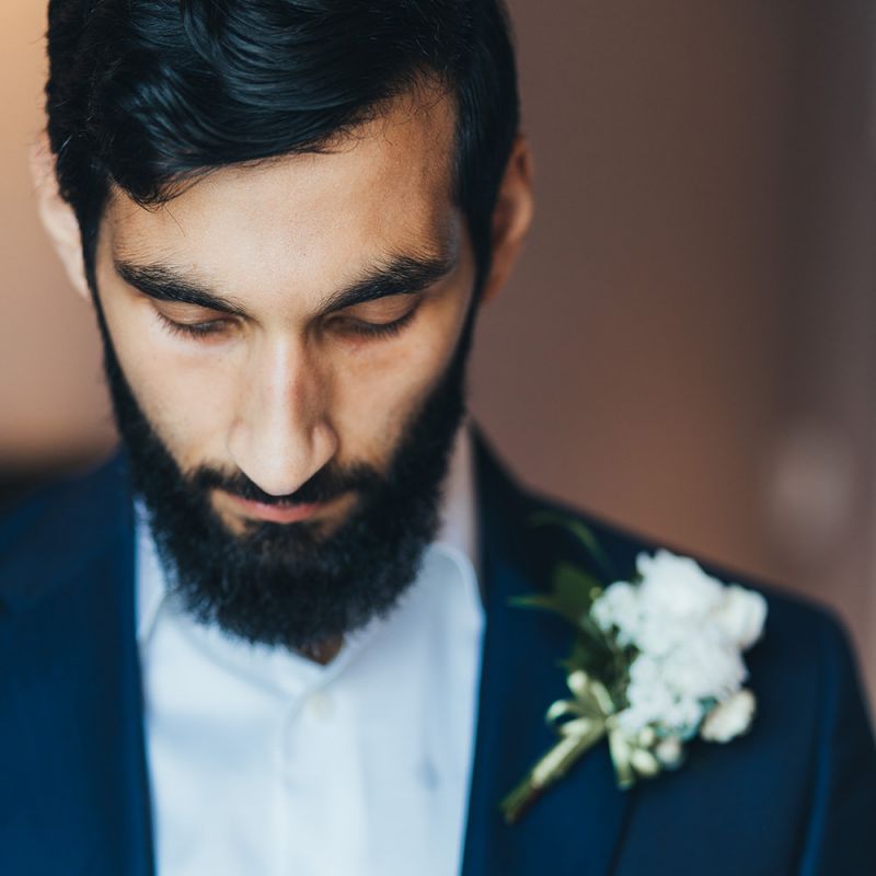 Bearded Groom in Navy Suit with White Flower Buttonhole