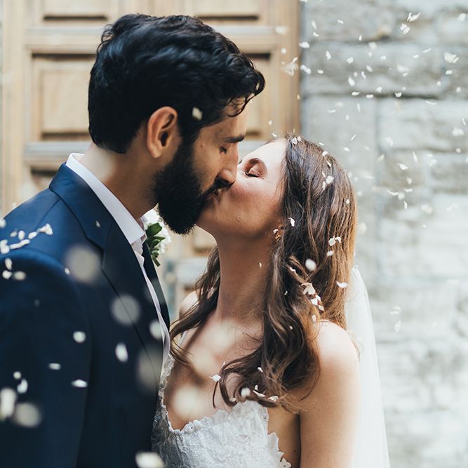 Confetti Moment with Bride in Grace Loves Lace Mia Wedding Dress and Groom in Taliare Navy Suit
