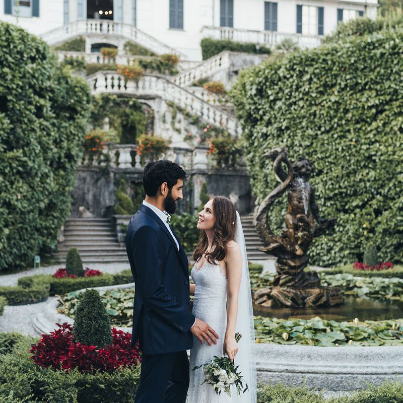 Portrait of Bride in Grace Loves Lace Mia Wedding Dress and Groom in Taliare Navy Suit