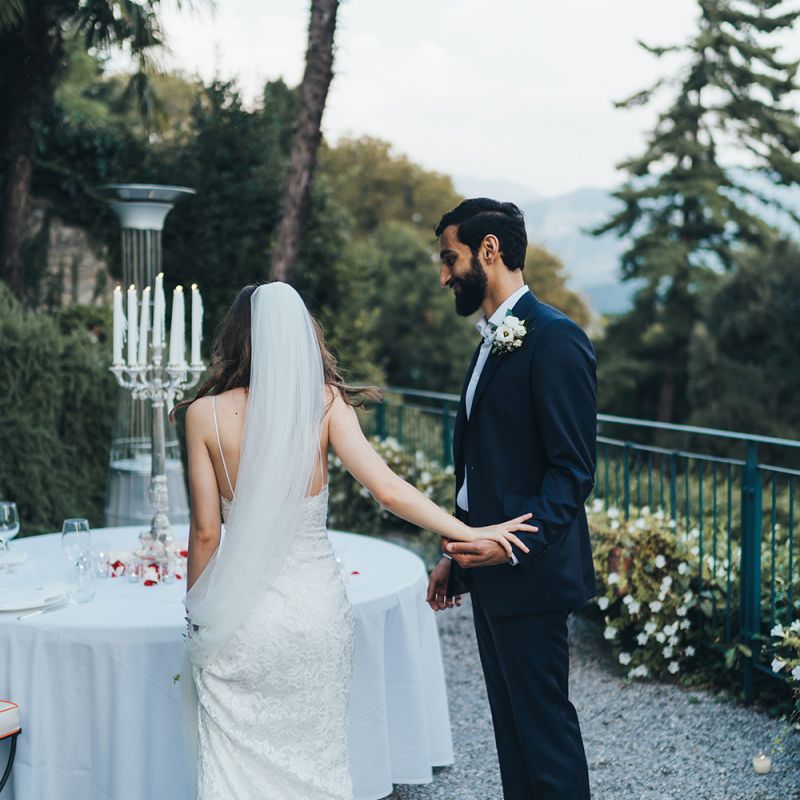 Bride in Grace Loves Lace Mia Wedding Dress and Groom in Taliare Navy Suit at their Intimate Wedding Reception