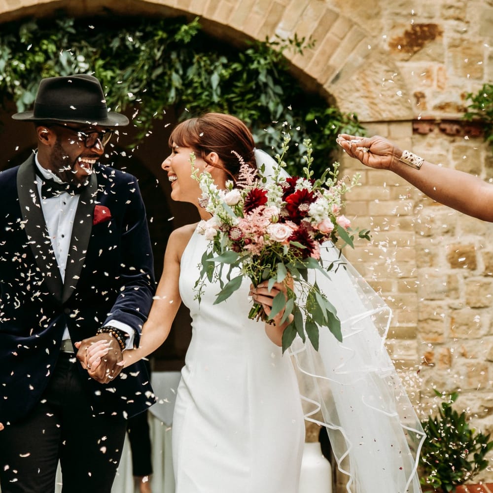 Bride and groom confetti moment at The Ravenswood