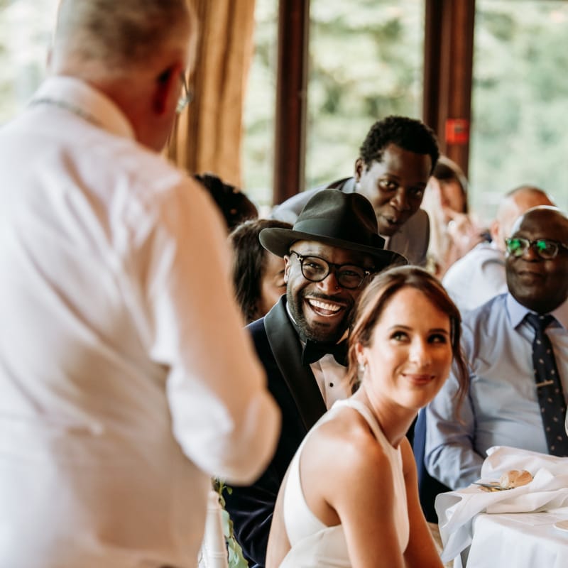 Groom smiling during the wedding speeches