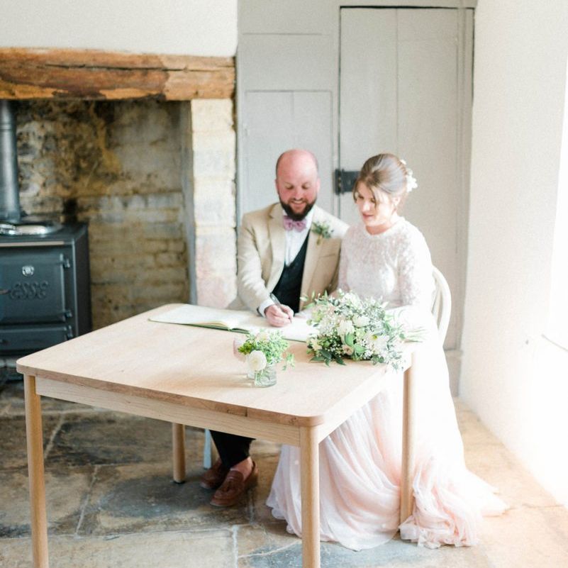 Bride and Groom Signing the Register