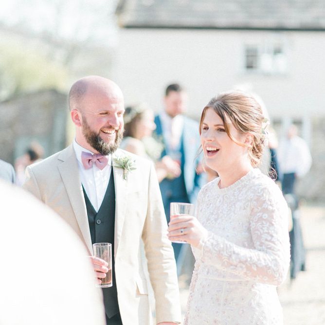 Bride and Groom Talking to Wedding Guests at the Drinks Reception