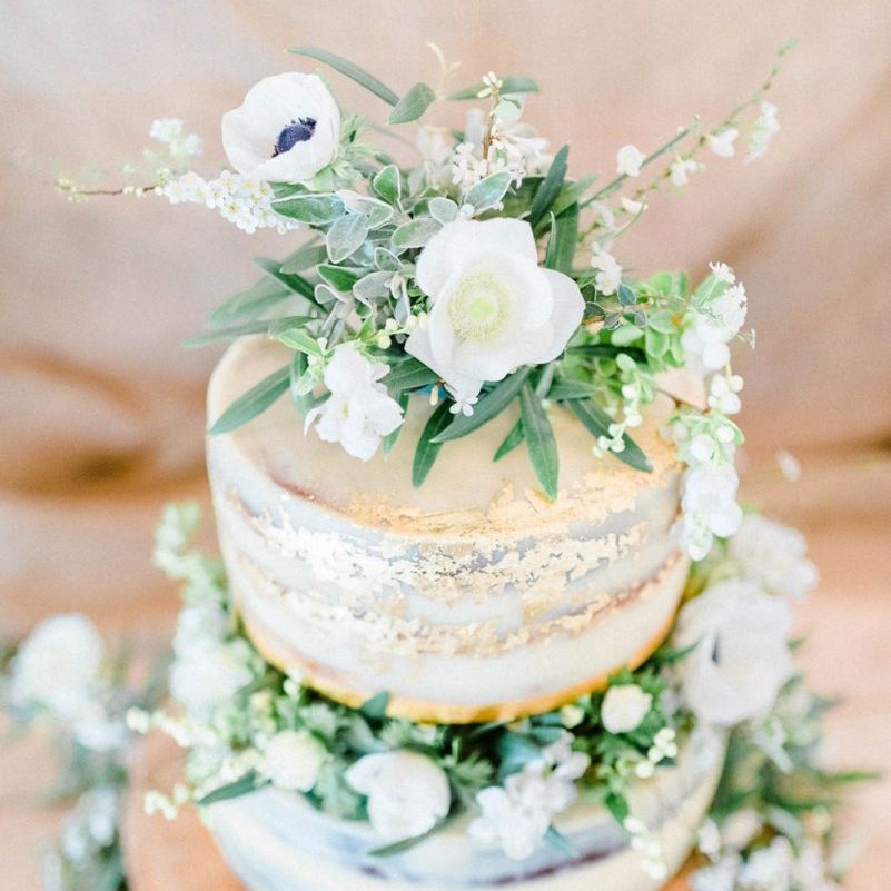 Semi Naked Wedding Cake Decorated with White and Green Flowers