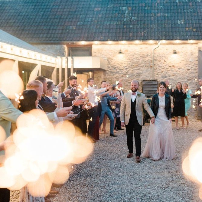 Sparkler Moment with Bride in Ombre Wedding Dress and Leather Jacket and From in Beige Blazer and Bow Tie.