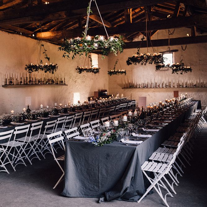 Wedding Reception Styled with Candles, Grey Tablecloths and Foliage Runners