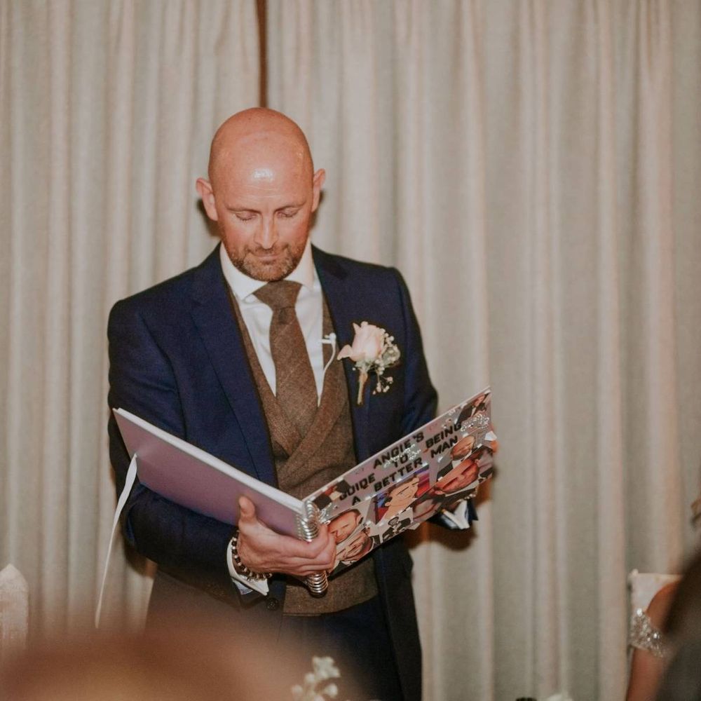 Bride and groom speeches at The Ferry House Inn reception with rustic styling and floral decor