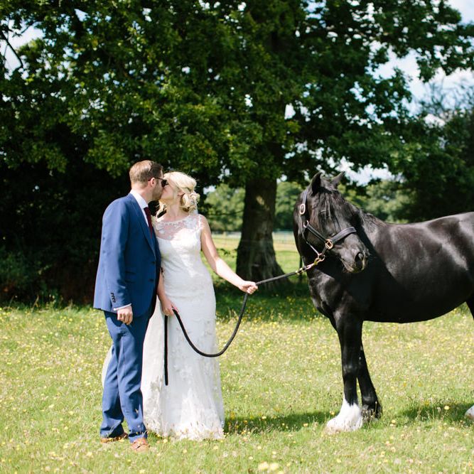 Bride in Claire Pettibone Whitney Bridal Gown with Cape | Groom in French Connection Navy Suit | DIY Country Wedding at Warborne Farm, Lymington | Camilla Arnhold Photography