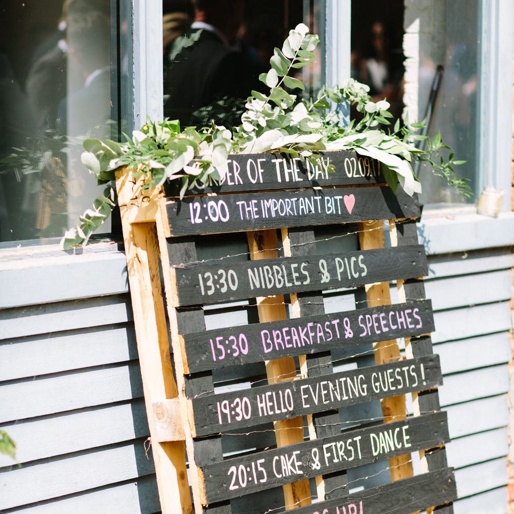 Wooden Palette Order of the Day Wedding Sign | DIY Country Wedding at Warborne Farm, Lymington | Camilla Arnhold Photography
