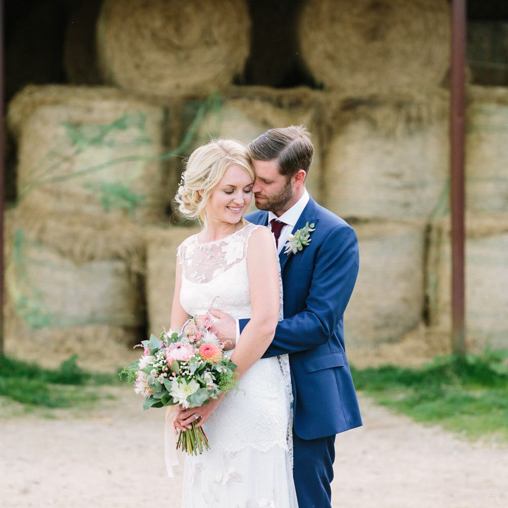 Bride in Claire Pettibone Whitney Bridal Gown with Cape | Groom in French Connection Navy Suit | DIY Country Wedding at Warborne Farm, Lymington | Camilla Arnhold Photography