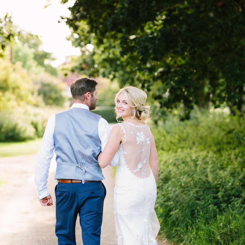 Bride in Claire Pettibone Whitney Bridal Gown with Cape | Groom in French Connection Navy Suit | DIY Country Wedding at Warborne Farm, Lymington | Camilla Arnhold Photography