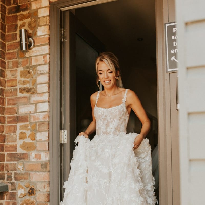 Boho bride in lace Galia Lahav wedding dress for August 2020 wedding