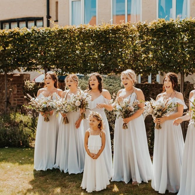 Bridal party first look in light blue dresses
