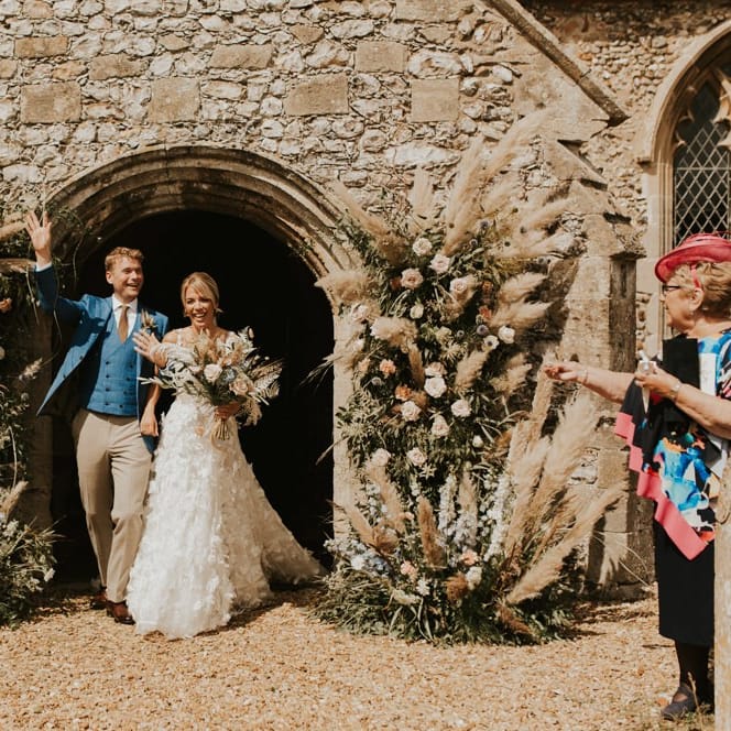 Bride and Groom exiting the church after their August 2020 wedding
