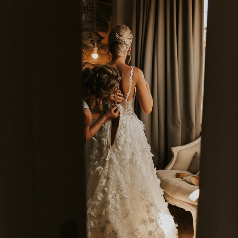 Bride getting ready into her Galia Lahav wedding dress
