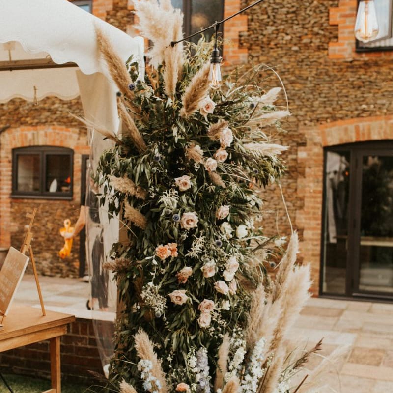 Verticle wedding flower arrangement with pampas grass for August 2020 wedding reception