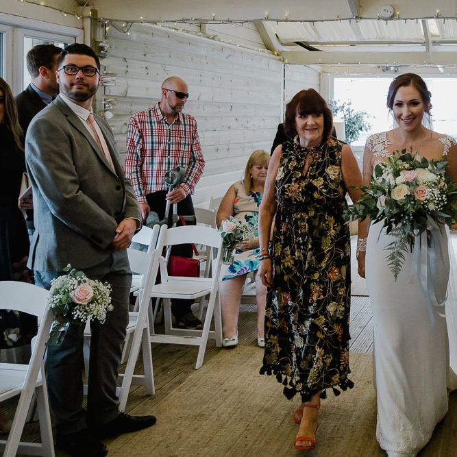 Wedding Ceremony Bridal Entrance in Long Sleeve Lace Martina Liana Wedding Dress Escorted by Mother-of-the-Bride | Lusty Glaze Beach Wedding Newquay Cornwall | Alexa Poppe Photography