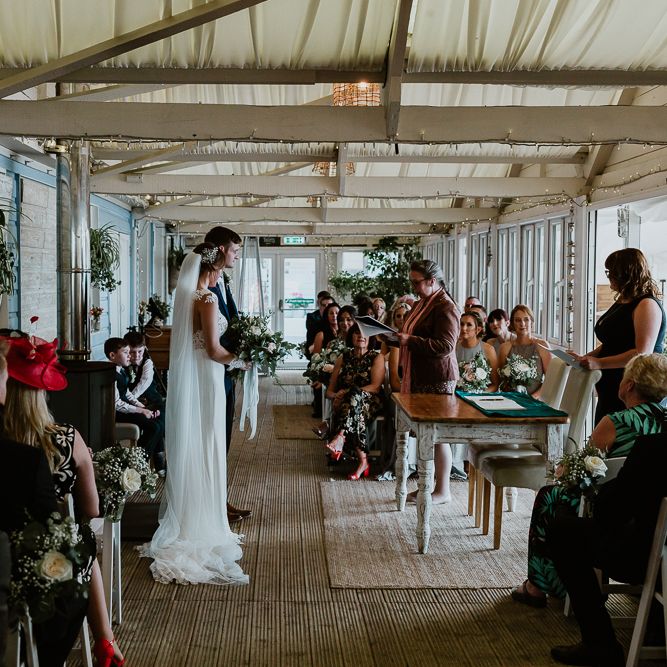 Wedding Ceremony | Bride in Lace Long Sleeve Martina Liana Wedding Dress | Groom in Navy Three-piece Suit | Lusty Glaze Beach Wedding Newquay Cornwall | Alexa Poppe PhotographyLusty Glaze Beach Wedding Newquay Cornwall | Alexa Poppe Photography