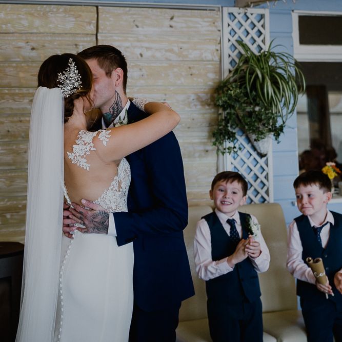 Wedding Ceremony | Bride in Lace Long Sleeve Martina Liana Wedding Dress | Groom in Navy Three-piece Suit | Lusty Glaze Beach Wedding Newquay Cornwall | Alexa Poppe PhotographyLusty Glaze Beach Wedding Newquay Cornwall | Alexa Poppe Photography