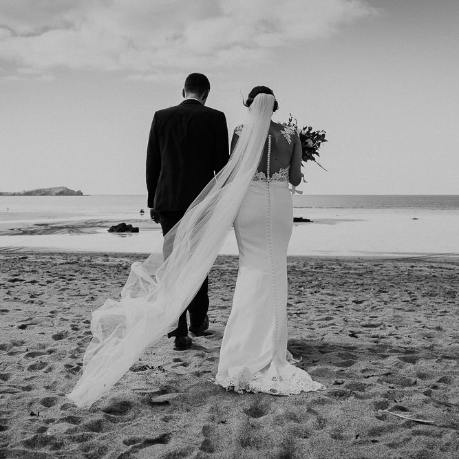 Coastal Portrait | Bride in Lace Long Sleeve Martina Liana Wedding Dress | Groom in Navy Three-piece Suit | Lusty Glaze Beach Wedding Newquay Cornwall | Alexa Poppe PhotographyLusty Glaze Beach Wedding Newquay Cornwall | Alexa Poppe Photography