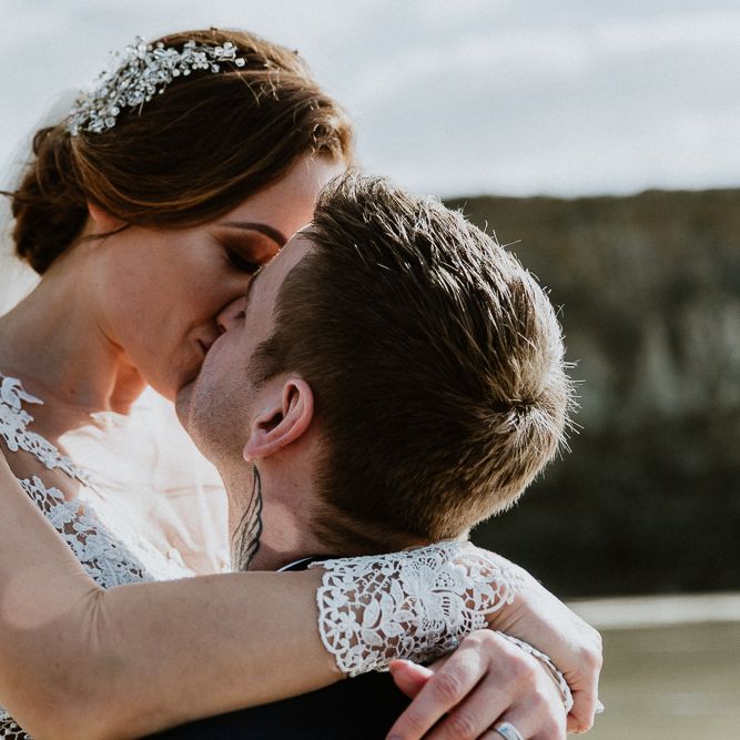 Coastal Portrait | Bride in Lace Long Sleeve Martina Liana Wedding Dress | Groom in Navy Three-piece Suit | Lusty Glaze Beach Wedding Newquay Cornwall | Alexa Poppe PhotographyLusty Glaze Beach Wedding Newquay Cornwall | Alexa Poppe Photography