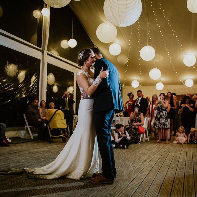 First Dance | Festoon Lights | White Lanterns | Bride in Lace Long Sleeve Martina Liana Wedding Dress | Groom in Navy Three-piece Suit | Lusty Glaze Beach Wedding Newquay Cornwall | Alexa Poppe PhotographyLusty Glaze Beach Wedding Newquay Cornwall | Alexa Poppe Photography