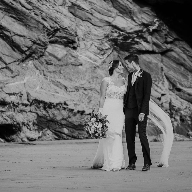 Coastal Portrait | Bride in Lace Long Sleeve Martina Liana Wedding Dress | Groom in Navy Three-piece Suit | Lusty Glaze Beach Wedding Newquay Cornwall | Alexa Poppe PhotographyLusty Glaze Beach Wedding Newquay Cornwall | Alexa Poppe Photography