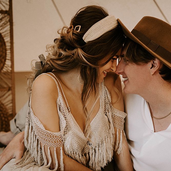 Boho Couple Embracing in a Bell Tent