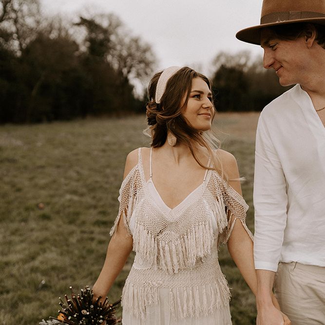 Boho Couple with Bride in Fringe Wedding Dress and Groom in Casual Shirt and Chino's