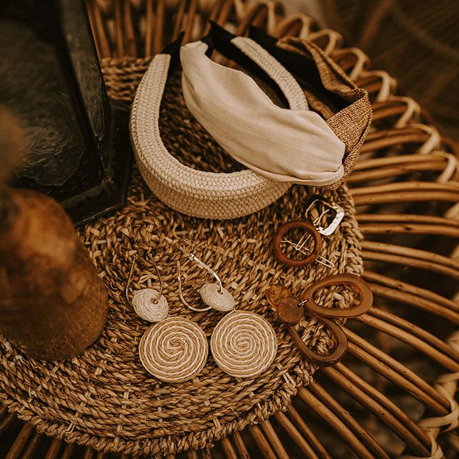 Bridal Accessories and Earrings on Wicker Table