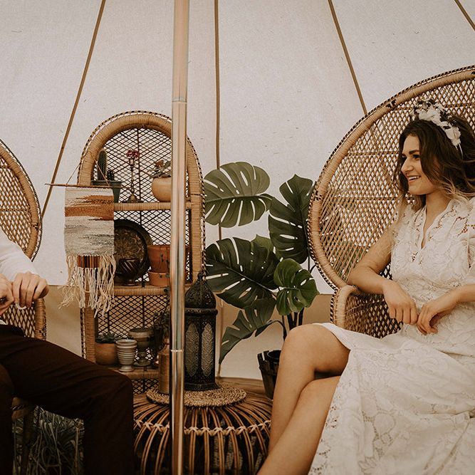 Boho Bride and Groom Relaxing in Peacock Chairs
