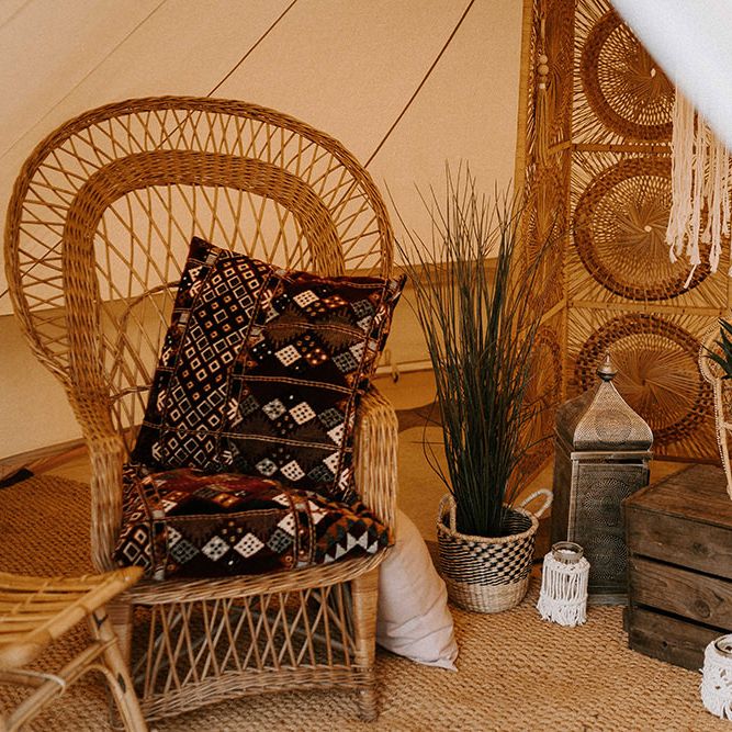 Wicker Chair and Moroccan Cushions for Relaxed Seating Area within w Bell Tent