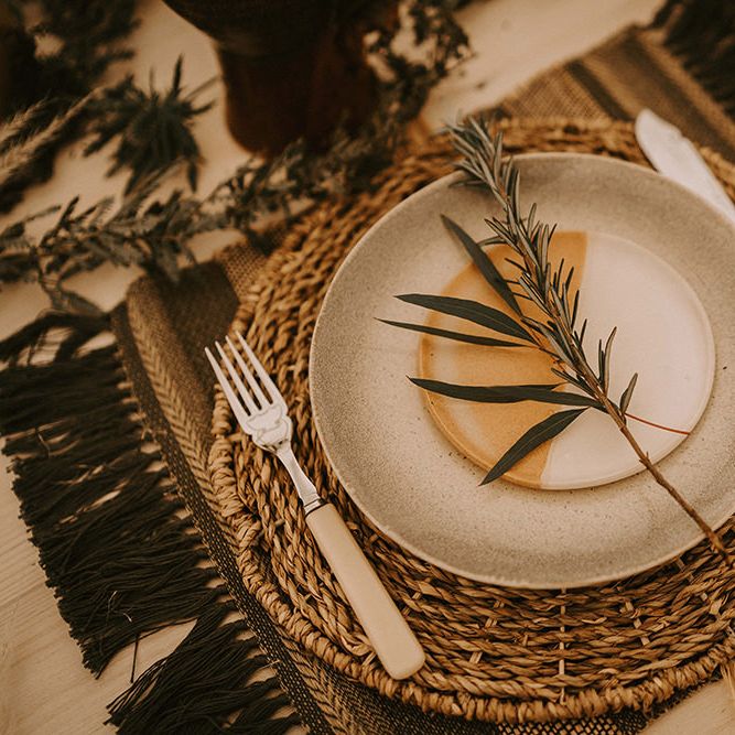 Place Setting with Ceramic Plate, Wicker Place Mat and Ivory Knife and Fork