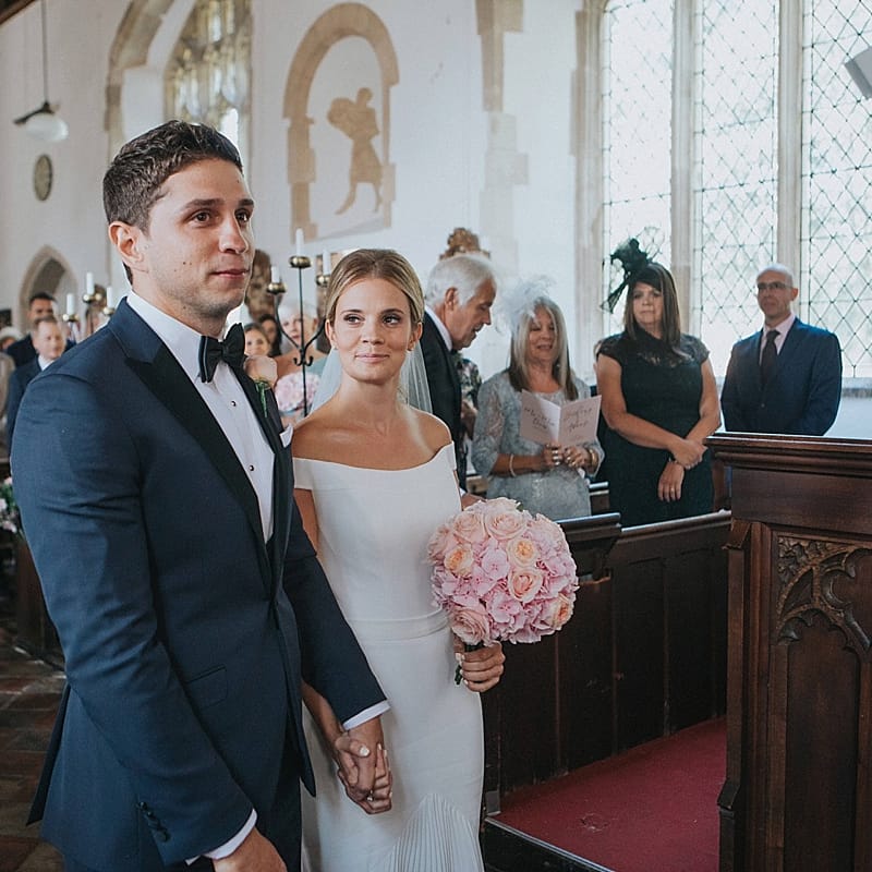 Church Wedding Ceremony | Bride in Suzanne Neville Bardot Nouveau Wedding Dress | Groom in Black Tie | Pastel Pink &amp; Mint Green Wedding at Granary Estates Suffolk | Julia &amp; You Photography