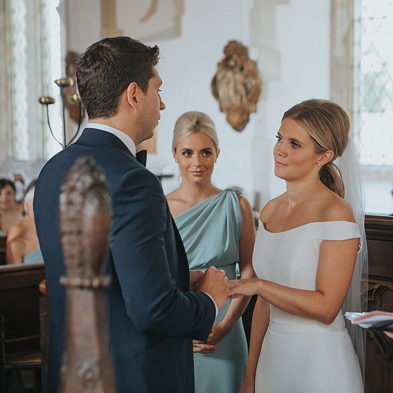 Church Wedding Ceremony | Bride in Suzanne Neville Bardot Nouveau Wedding Dress | Groom in Black Tie | Pastel Pink &amp; Mint Green Wedding at Granary Estates Suffolk | Julia &amp; You Photography