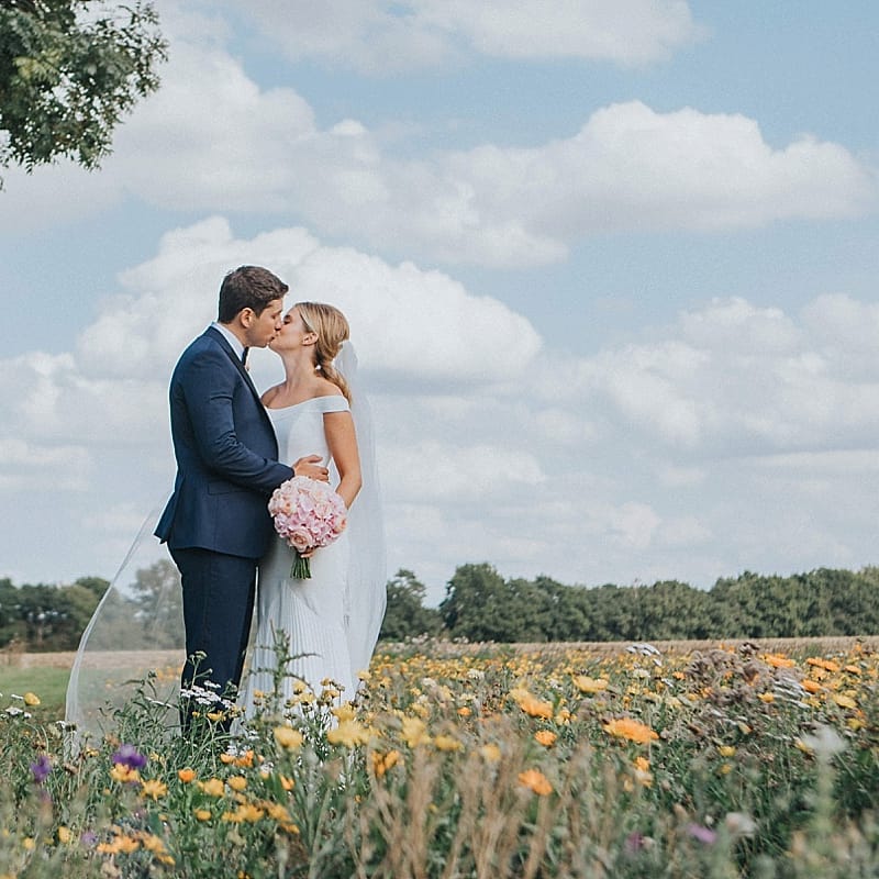 Bride in Suzanne Neville Bardot Nouveau Wedding Dress | Groom in Black Tie | Pastel Pink &amp; Mint Green Wedding at Granary Estates Suffolk | Julia &amp; You Photography