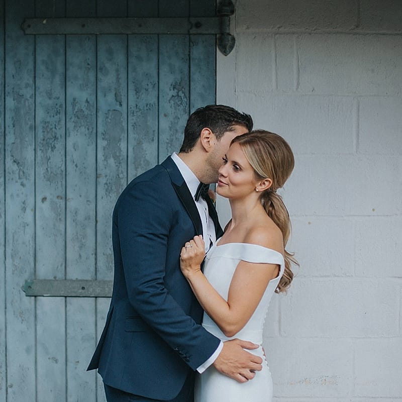 Bride in Suzanne Neville Bardot Nouveau Wedding Dress | Groom in Black Tie | Pastel Pink &amp; Mint Green Wedding at Granary Estates Suffolk | Julia &amp; You Photography