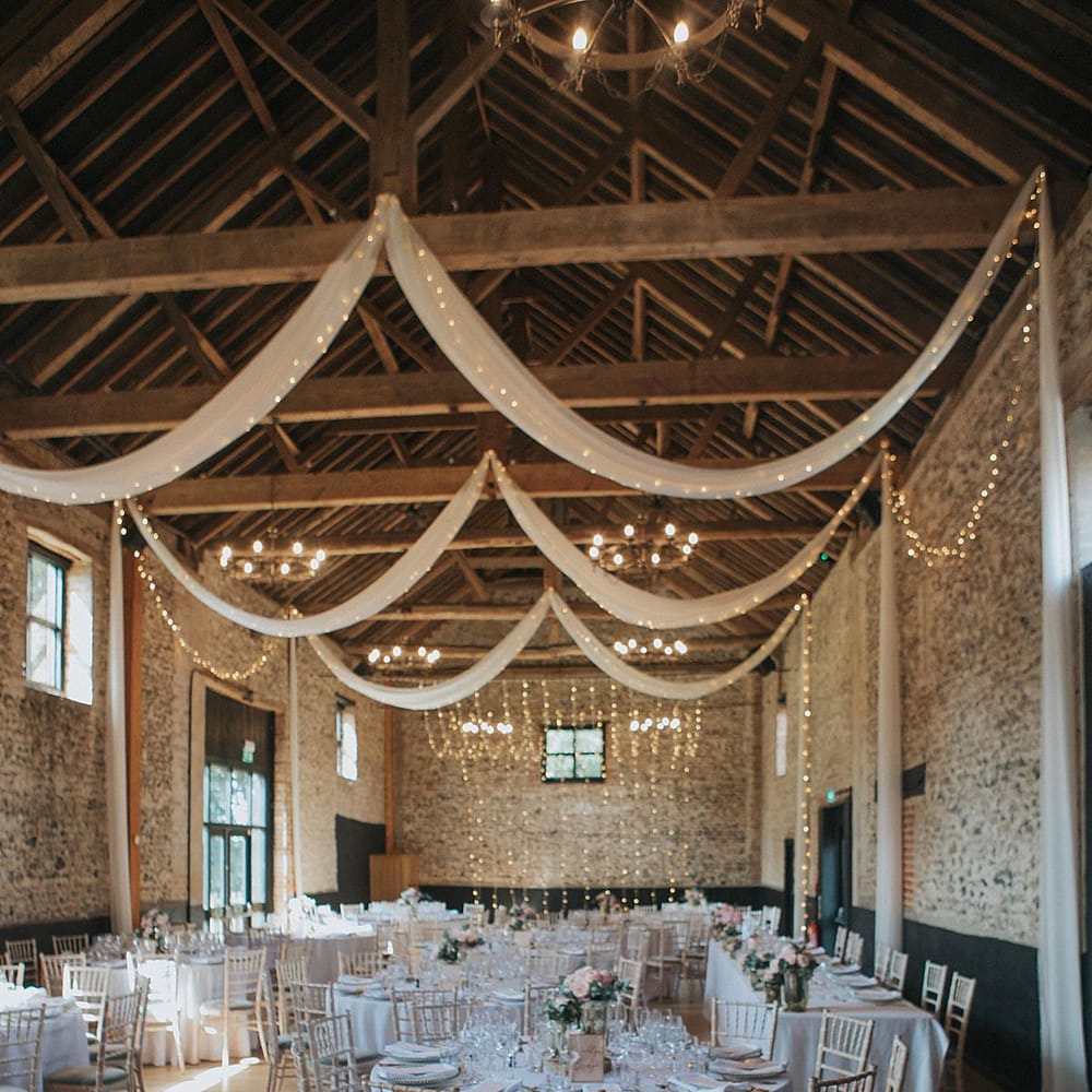 Fairy Lights &amp; Drapes Wedding Reception Decor | Pastel Pink &amp; Mint Green Wedding at Granary Estates Suffolk | Julia &amp; You Photography