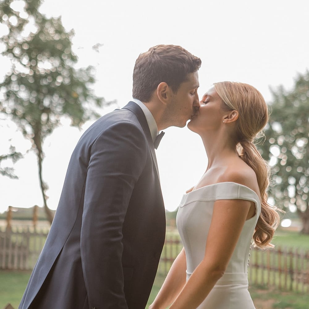Bride in Suzanne Neville Bardot Nouveau Wedding Dress | Groom in Black Tie | Pastel Pink &amp; Mint Green Wedding at Granary Estates Suffolk | Julia &amp; You Photography