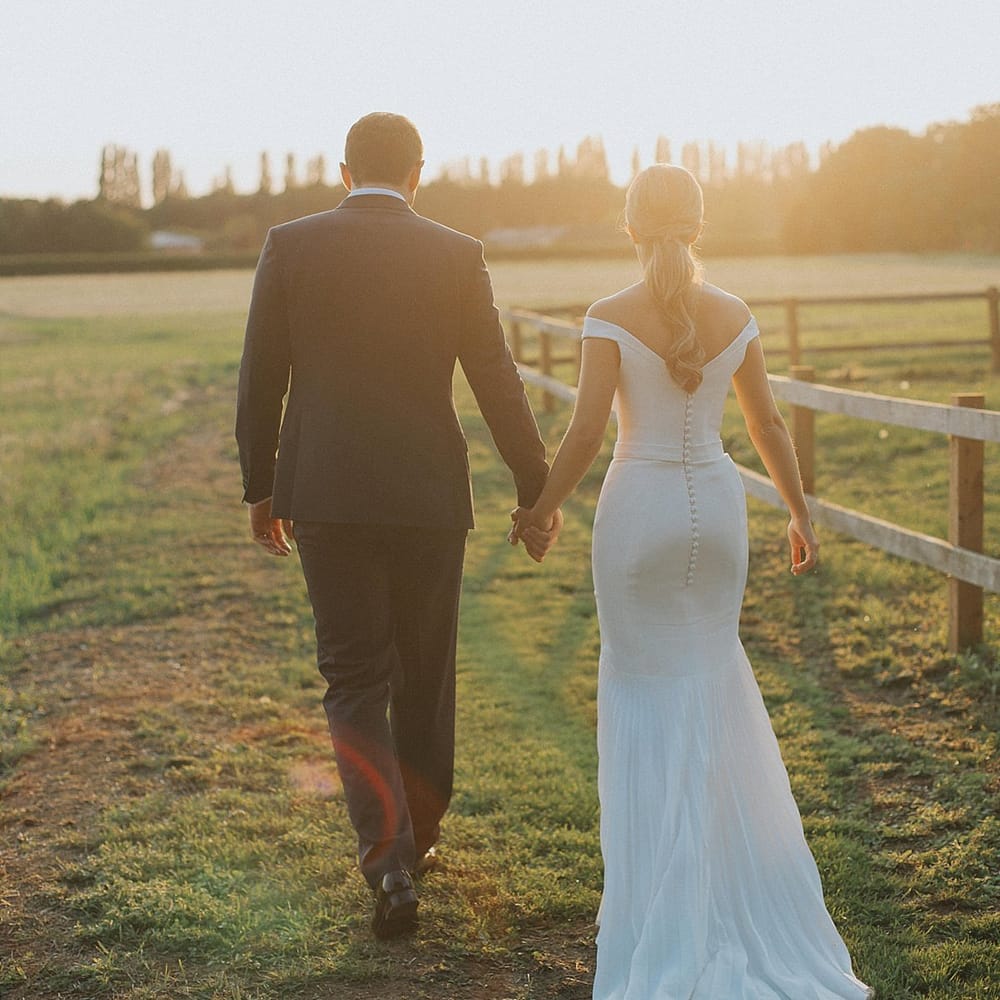 Sunset Portrait | Bride in Suzanne Neville Bardot Nouveau Wedding Dress | Groom in Black Tie | Pastel Pink &amp; Mint Green Wedding at Granary Estates Suffolk | Julia &amp; You Photography