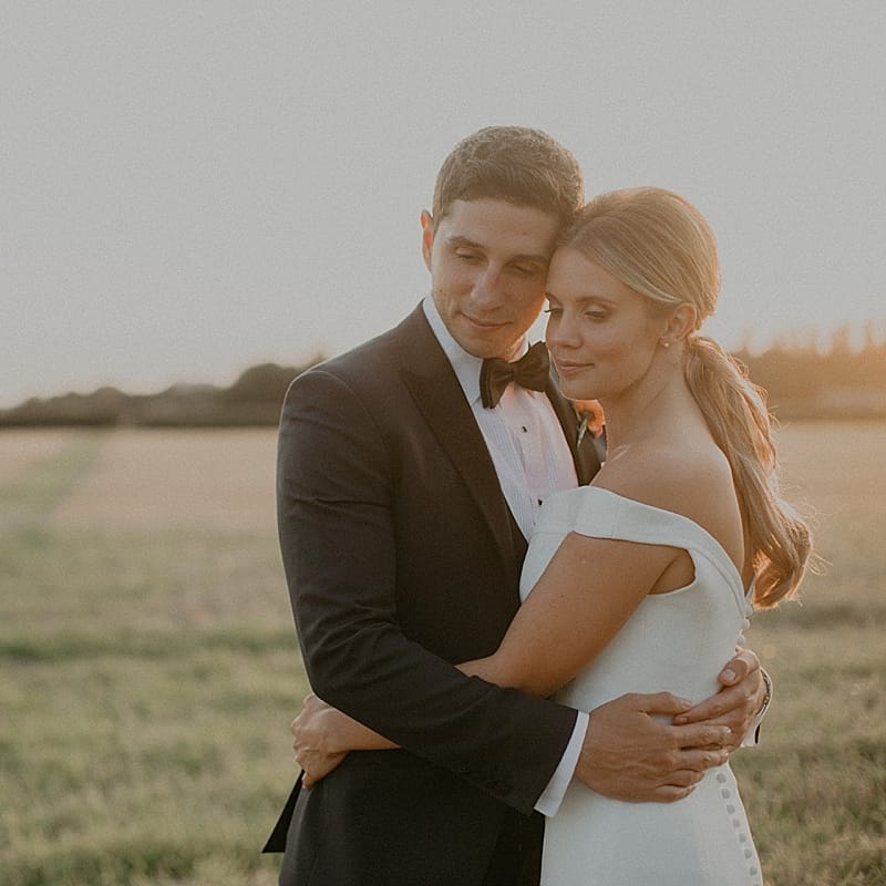 Bride in Suzanne Neville Bardot Nouveau Wedding Dress | Groom in Black Tie | Pastel Pink &amp; Mint Green Wedding at Granary Estates Suffolk | Julia &amp; You Photography
